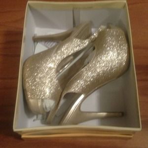 Gold glitter high heel shoes