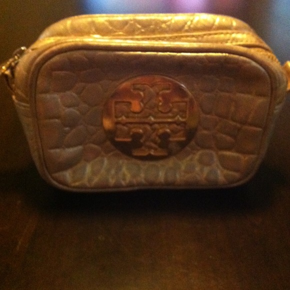 Tory Burch Gold metallic cosmetic bag.