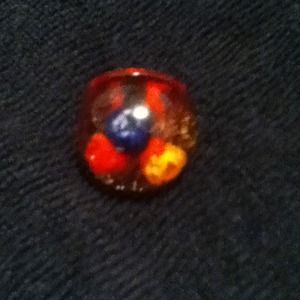 Red gel ring with flowers inside