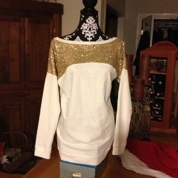 Cream and gold tunic top.