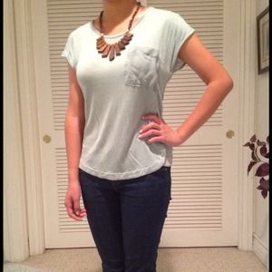 Mint green top with pocket and button detailing