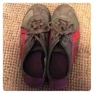 Grey tiger asics with pink and purple details.