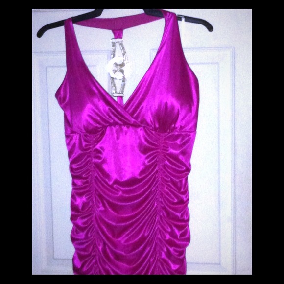 Mini dress. Above the knee, fuschia  colored dress