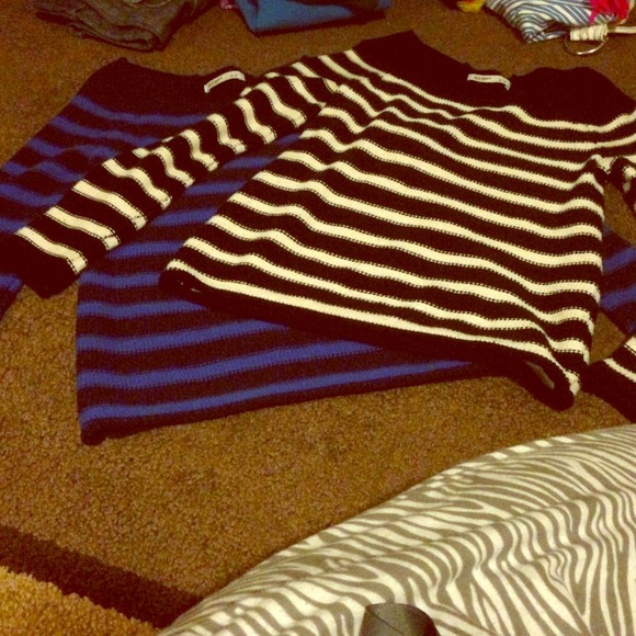 Boat neck sweaters.