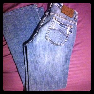 Distressed light blue jeans