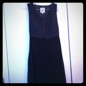 Jersey black dress with attached sleeveless vest.