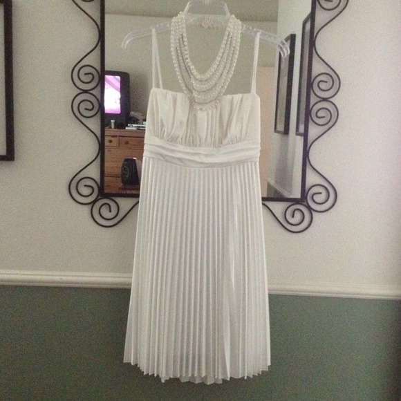White pleated dress, collared rhinestone bead neck