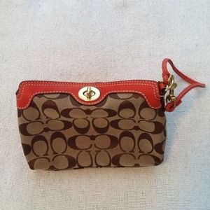***RESERVED***Coach coral and tan wristlet NWOT