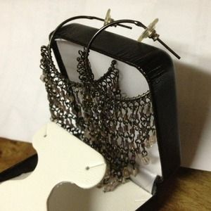 Black dangling earrings.