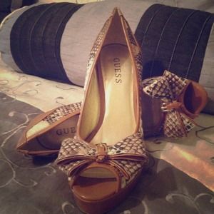 Guess high heels,been wore once. Tan snake skin