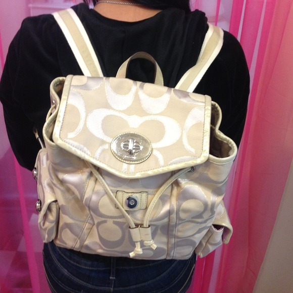 Cream and gold coach backpack