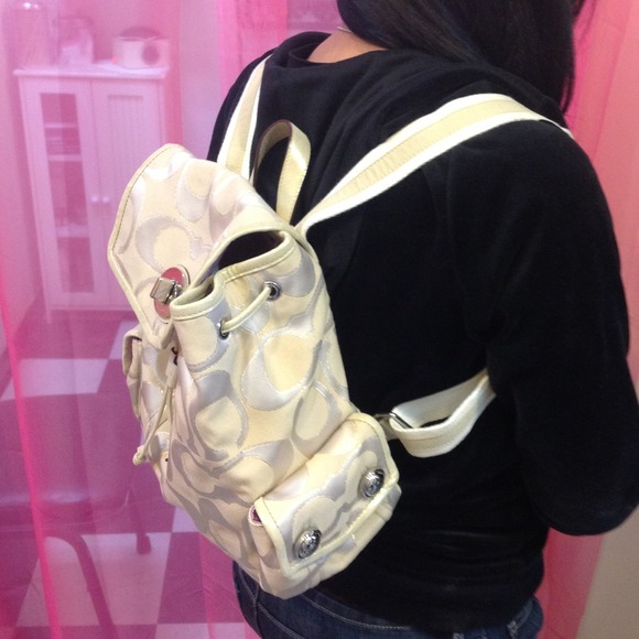 Cream and gold coach backpack