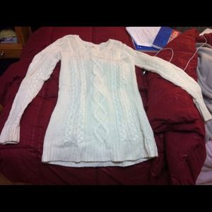 Cream-colored, loose-stitched sweater