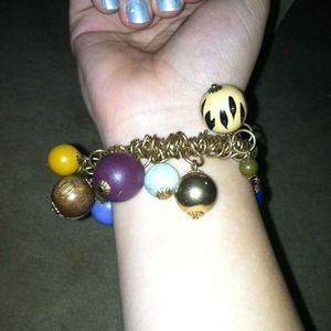Gold bracelet with charms