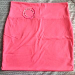 Stretch neon skirt. Pink/white hoop earrings.