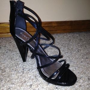 Black. 4-inch heel. Wraps around foot. Zipper.