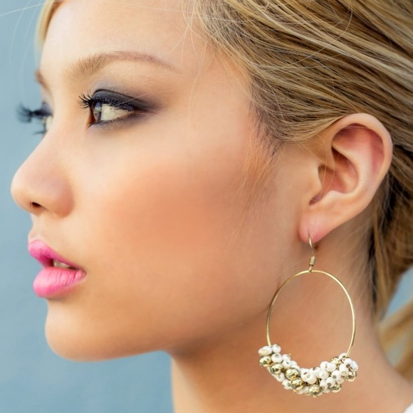 White & gold ornamental earrings