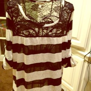 Classic striped top with lace accent.