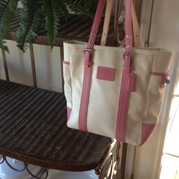 Authentic Coach Handbag with pink leather trim.