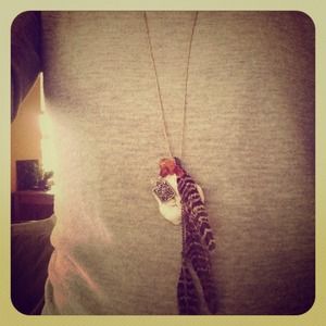 Hand made feather and white stone necklace.