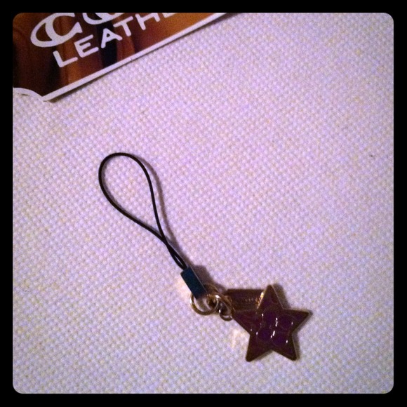 Coach "purple star" cell phone charm.