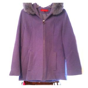 Wool coat with fox fur trimmed hood.