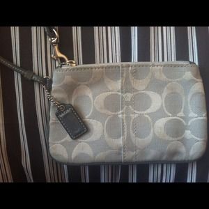 Silver Coach Wristlet.