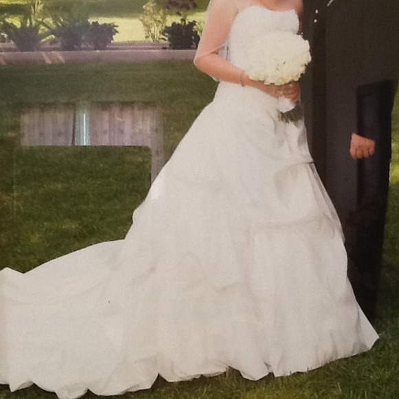 This gown will be available in June. It's ivory.