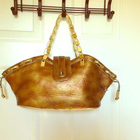 Old Vintage Goldd bronze  Louis Vitton.