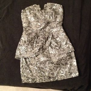 Brocade sleeveless peplum cocktail dress