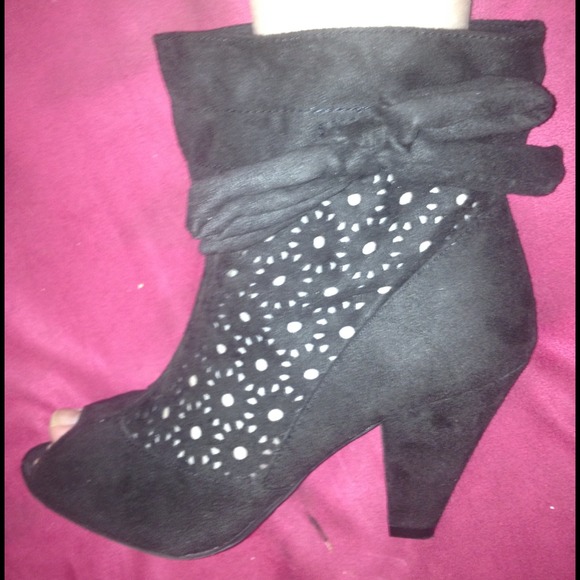 Pair of peep toe black ankle high boots
