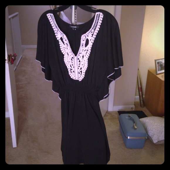 Pretty black tunic/dress with lace detail.