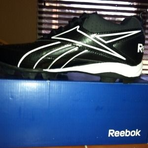 Boys football cleats.. Never worn