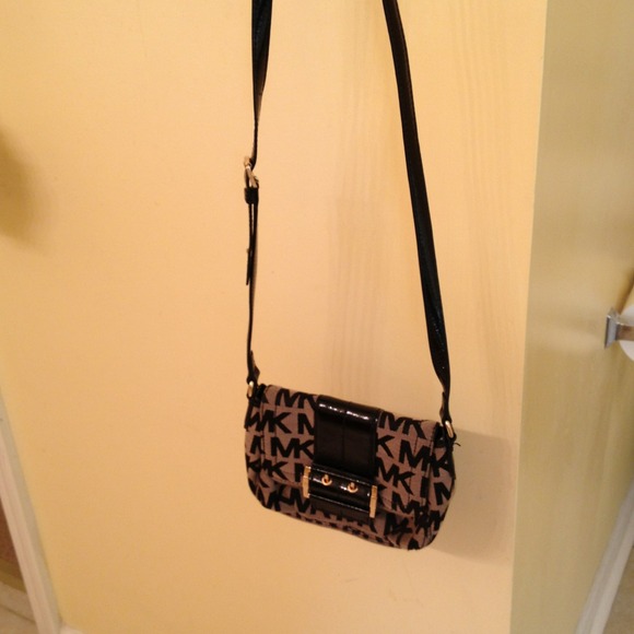 Authentic Michael Kors cross body bag.  Reserved