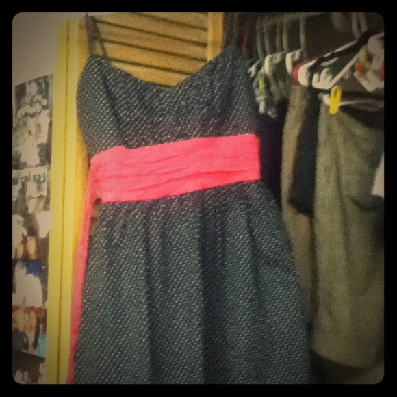 Black and white Polk a dot dress with pink sash