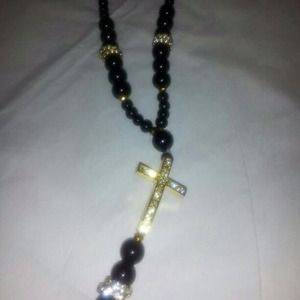 Black necklace with diamond cross