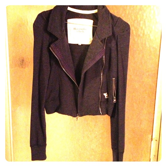 Short zip up navy blue jacket.