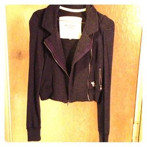 Short zip up navy blue jacket.