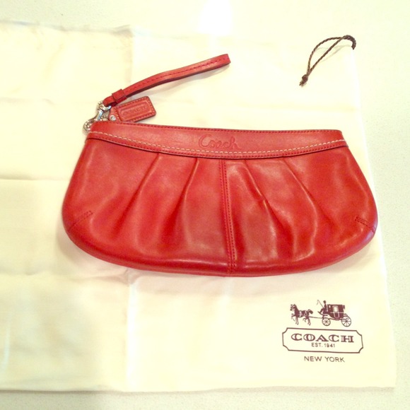 Burnt orange authentic Coach leather clutch