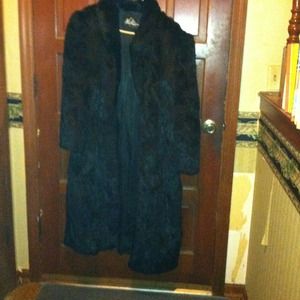Black full length rabbit fur coat.