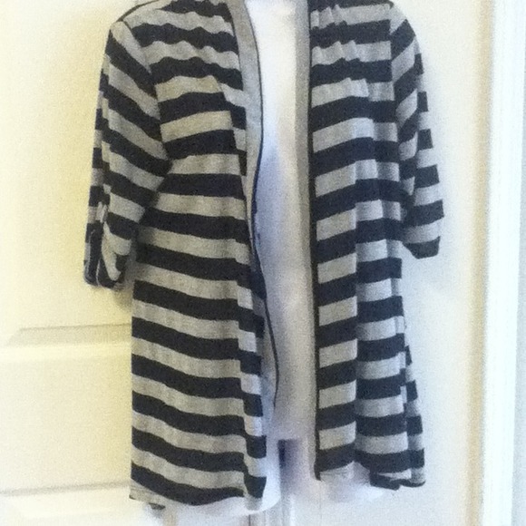 Grey and black striped short sleeve sweater.