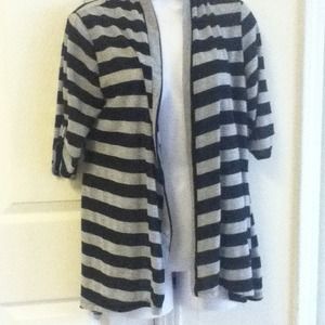 Grey and black striped short sleeve sweater.