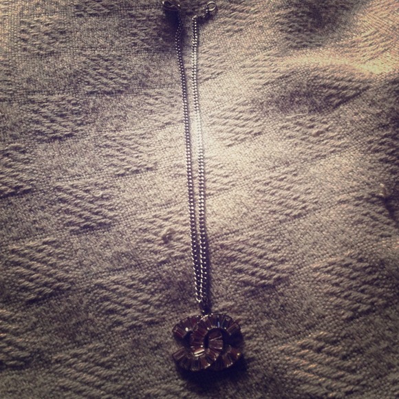 guaranteed authentic CHANEL necklace.