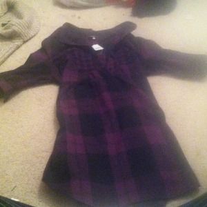 Long plaid shirt.  Three quarter length sleeves.