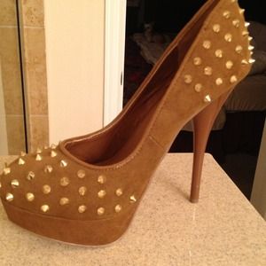 Worn once spiked pumps.  Size 7.5