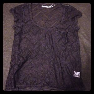 See through lace shirt.