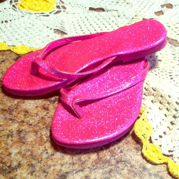 Pink shiny flip flops