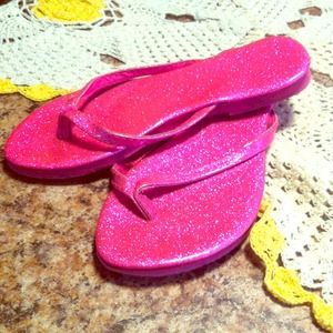 Pink shiny flip flops