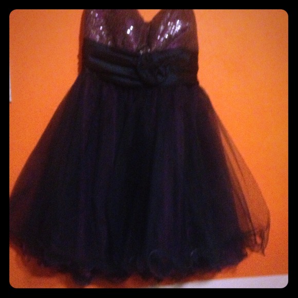 A purple and navy blue short dress with sparkles