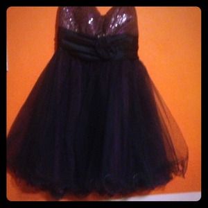 A purple and navy blue short dress with sparkles